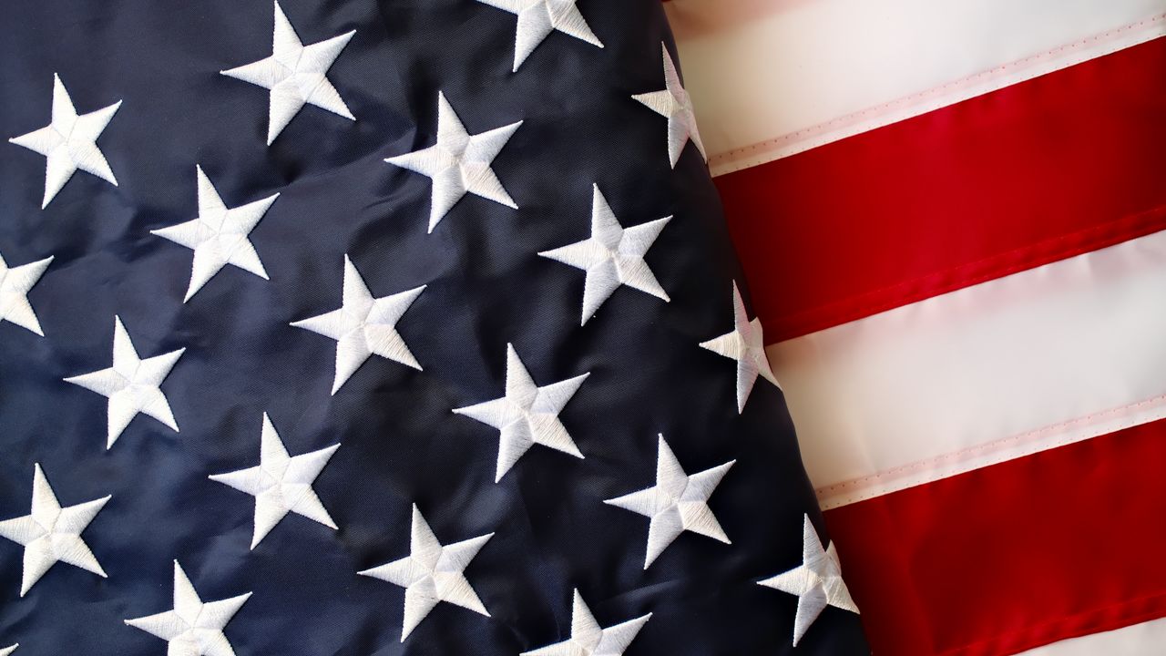 Detailed view of the American flag's stars and stripes representing USA patriotism.